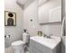 Half bathroom features a modern vanity with stylish fixtures and contemporary decor at 1335 Elizabeth Ave Sw, Atlanta, GA 30310