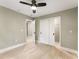Neutral bedroom with a ceiling fan, closet, and wood-look flooring for a cozy atmosphere at 1335 Elizabeth Ave Sw, Atlanta, GA 30310