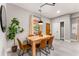 Cozy dining area featuring a wooden table, stylish chairs, and a decorative plant for a welcoming atmosphere at 1335 Elizabeth Ave Sw, Atlanta, GA 30310