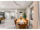 Bright dining room featuring a modern wooden table, comfortable seating, and elegant window treatments at 1335 Elizabeth Ave Sw, Atlanta, GA 30310