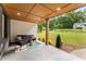 Inviting covered porch featuring stylish seating, a rug, and an open view of the surrounding yard at 1335 Elizabeth Ave Sw, Atlanta, GA 30310