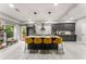 Bright open kitchen with gray cabinets, a large center island, and stylish pendant lighting at 1335 Elizabeth Ave Sw, Atlanta, GA 30310