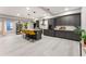 Spacious kitchen featuring gray cabinets, a large island with bar seating, and modern stainless steel appliances at 1335 Elizabeth Ave Sw, Atlanta, GA 30310