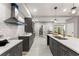 Modern kitchen with gray cabinets, white countertops, stainless steel appliances and subway tile backsplash at 1335 Elizabeth Ave Sw, Atlanta, GA 30310