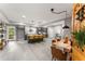Open-concept kitchen and dining area with modern gray cabinetry, a spacious island, and stylish decor at 1335 Elizabeth Ave Sw, Atlanta, GA 30310