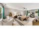 Spacious main bedroom with seating area, ceiling fan, and natural light, perfect for relaxation at 1335 Elizabeth Ave Sw, Atlanta, GA 30310