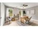 Cozy home office with natural light from two windows, complemented by wood flooring and neutral decor at 1335 Elizabeth Ave Sw, Atlanta, GA 30310