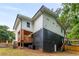 Back of home features a two-story deck and finished basement with exterior access at 1335 Elizabeth Ave Sw, Atlanta, GA 30310