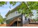 Back of house featuring decks and stairs, with natural surroundings providing a private outdoor space at 1335 Elizabeth Ave Sw, Atlanta, GA 30310