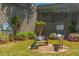 Secluded backyard patio area with a bench, landscaping, retaining wall, and brick-paved area at 2075 Old Georgian Nw Ter, Atlanta, GA 30318
