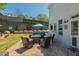 Charming backyard with a hot tub, patio seating, a privacy fence, lush landscaping, and exterior TV at 2075 Old Georgian Nw Ter, Atlanta, GA 30318