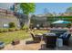 Landscaped backyard with a patio, outdoor furniture, a spa, and a retaining wall at 2075 Old Georgian Nw Ter, Atlanta, GA 30318
