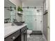 Modern bathroom featuring a stylish vanity, unique vessel sink, and sleek glass-enclosed shower, providing a spa-like atmosphere at 2075 Old Georgian Nw Ter, Atlanta, GA 30318