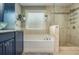 Bright bathroom showcasing a bathtub, walk-in shower, and stylish fixtures, offering a luxurious and relaxing space at 2075 Old Georgian Nw Ter, Atlanta, GA 30318