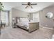 Bright bedroom with a neutral color palette, ceiling fan, and natural light, offering a tranquil and comfortable retreat at 2075 Old Georgian Nw Ter, Atlanta, GA 30318