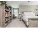 Inviting bedroom featuring a bookshelf, natural light, and neutral color palette, creating a cozy and peaceful space at 2075 Old Georgian Nw Ter, Atlanta, GA 30318