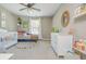 Charming Bedroom featuring a crib, daybed, and playful decor, creating a nurturing and stimulating environment for a  at 2075 Old Georgian Nw Ter, Atlanta, GA 30318