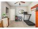 Functional bedroom with a desk, bookshelf, and treadmill at 2075 Old Georgian Nw Ter, Atlanta, GA 30318