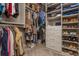 Walk-in closet with custom shelving and ample storage space for clothes, shoes, and accessories, optimizing organization at 2075 Old Georgian Nw Ter, Atlanta, GA 30318