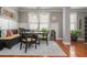 Elegant dining room with a stylish light fixture, wainscoting, and ample natural light at 2075 Old Georgian Nw Ter, Atlanta, GA 30318