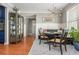 Charming dining area with a built-in bench, display cabinet, and open view to the kitchen at 2075 Old Georgian Nw Ter, Atlanta, GA 30318