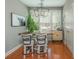 Charming dining area with a wooden table, bar stools, and natural light at 2075 Old Georgian Nw Ter, Atlanta, GA 30318