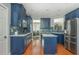 Contemporary kitchen with stainless steel appliances, blue cabinetry, and an island at 2075 Old Georgian Nw Ter, Atlanta, GA 30318