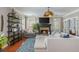 A cozy living room with a fireplace, comfortable seating, hardwood floors, and stylish decor creates an inviting atmosphere at 2075 Old Georgian Nw Ter, Atlanta, GA 30318