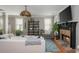 A cozy living room with a fireplace, comfortable seating, hardwood floors, and stylish decor creates an inviting atmosphere at 2075 Old Georgian Nw Ter, Atlanta, GA 30318