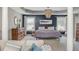 Spacious main bedroom with a tray ceiling, decorative chandelier, two windows and natural light at 2075 Old Georgian Nw Ter, Atlanta, GA 30318