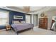 Spacious main bedroom features a decorative chandelier, two windows and natural light at 2075 Old Georgian Nw Ter, Atlanta, GA 30318