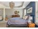 Spacious main bedroom with decorative chandelier, sitting area, and lots of natural light at 2075 Old Georgian Nw Ter, Atlanta, GA 30318