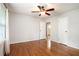 Spacious bedroom featuring hardwood floors, neutral walls, and two closets for ample storage at 3800 Whitaker Ln, Lithia Springs, GA 30122