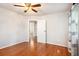 Bedroom with hardwood floors and view into a hall with other rooms at 3800 Whitaker Ln, Lithia Springs, GA 30122
