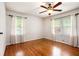 Bright bedroom with hardwood floors and dual windows providing plenty of natural light at 3800 Whitaker Ln, Lithia Springs, GA 30122