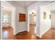 Hallway featuring hardwood floors and views into adjacent rooms at 3800 Whitaker Ln, Lithia Springs, GA 30122