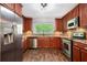 Updated kitchen with stainless steel appliances, granite countertops, and a large refrigerator at 3800 Whitaker Ln, Lithia Springs, GA 30122