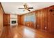 Inviting living room with hardwood floors and fireplace, bathed in natural light from a large window at 3800 Whitaker Ln, Lithia Springs, GA 30122