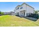 Large backyard with a patio, pergola, well-maintained lawn, and fenced area at 4105 Woodwind Dr, Cumming, GA 30028