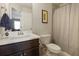 Modern bathroom features a white vanity top, dark wood cabinet, and a shower with a patterned curtain at 4105 Woodwind Dr, Cumming, GA 30028