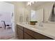 Double sink vanity in the bathroom, with a view of a hallway at 4105 Woodwind Dr, Cumming, GA 30028