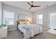 Cozy bedroom with a ceiling fan, natural light, and a comfortable bed at 4105 Woodwind Dr, Cumming, GA 30028