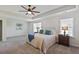 Bright bedroom featuring a ceiling fan, neutral walls, and stylish furnishings at 4105 Woodwind Dr, Cumming, GA 30028