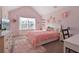 Inviting pink bedroom with a bed, desk, and natural light at 4105 Woodwind Dr, Cumming, GA 30028