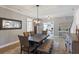 Elegant dining space featuring a decorative mirror and natural light at 4105 Woodwind Dr, Cumming, GA 30028