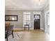 Inviting foyer with hardwood floors and a charming front door at 4105 Woodwind Dr, Cumming, GA 30028
