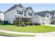 Charming home with well-kept lawn, lush landscaping, and a welcoming facade at 4105 Woodwind Dr, Cumming, GA 30028