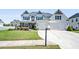 Beautiful two-story home featuring a manicured lawn, stone accents, and a two-car garage at 4105 Woodwind Dr, Cumming, GA 30028