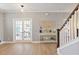 Bright and airy living area with staircase, and decor accents at 4105 Woodwind Dr, Cumming, GA 30028