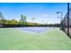 Outdoor tennis courts with lights and professional surface provide recreation and sport for residents and guests at 4105 Woodwind Dr, Cumming, GA 30028